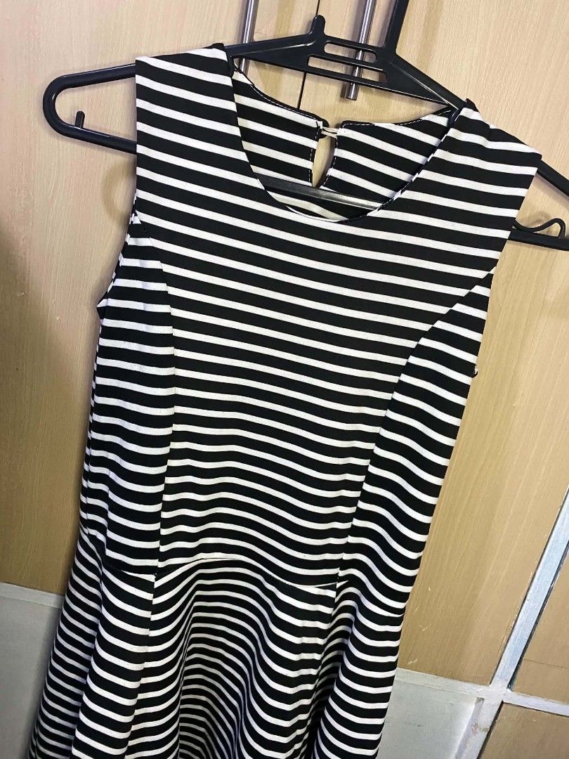 Striped Dress (Category: Dresses) located in Las Pinas. Submitted by modemnl (Listing ID 1464738967, Image 3). Description: Size: Medium | Color: Black & White A classic and stylish black and white striped dress that’s easy to wear and effortless to accessorize. The timeless stripe pattern makes it a versatile piece for both casual and dressier occasions. -Chic and timeless design -Comfortable and easy to style -Flattering dress silhouette -Perfe