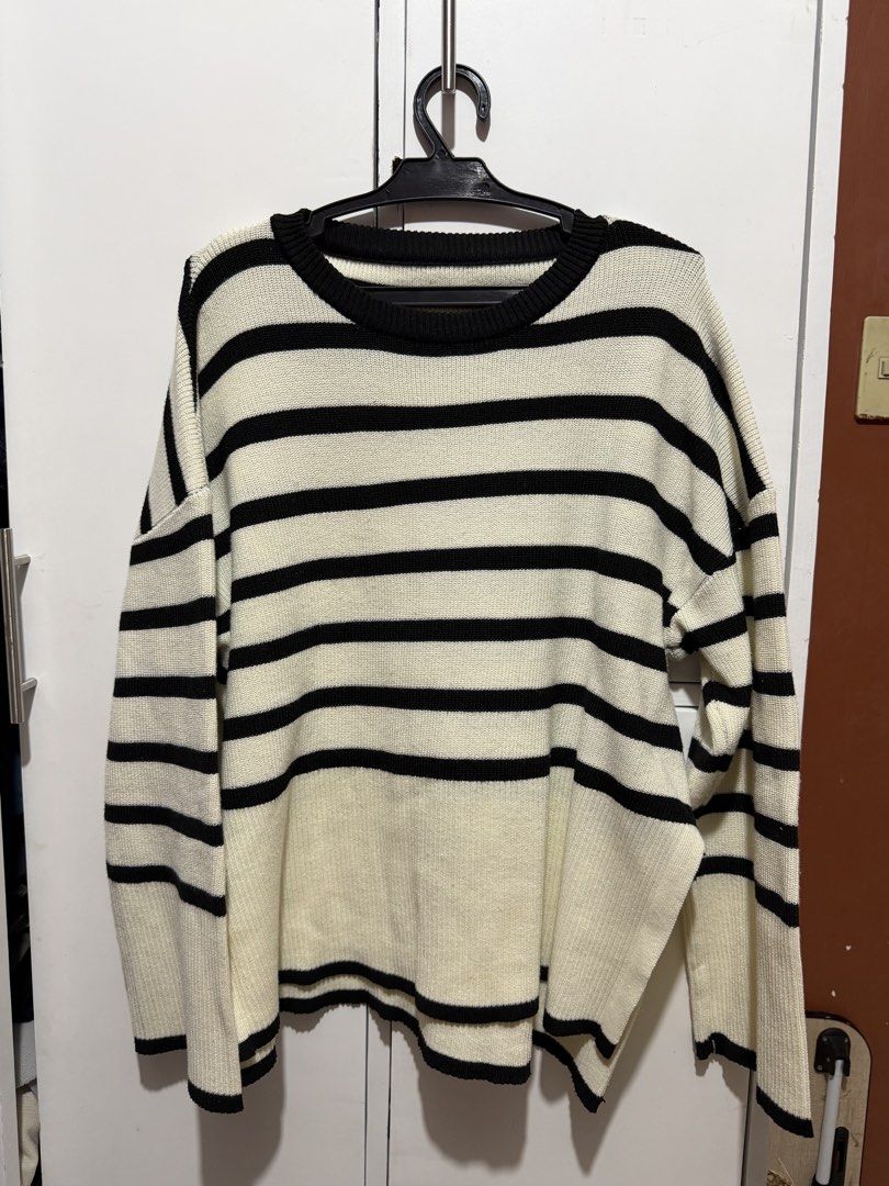 Striped Knit Sweater (Category: Longsleeves) located in Valenzuela. Submitted by sophysabelaa (Listing ID 1464621407, Image 1). Description: size S-M USED ONCE - Cream and black striped knit sweater - Long sleeves - Relaxed fit - Crew neckline - Cozy and stylish - Great for layering or wearing on its own - Easy to pair with jeans or skirts.