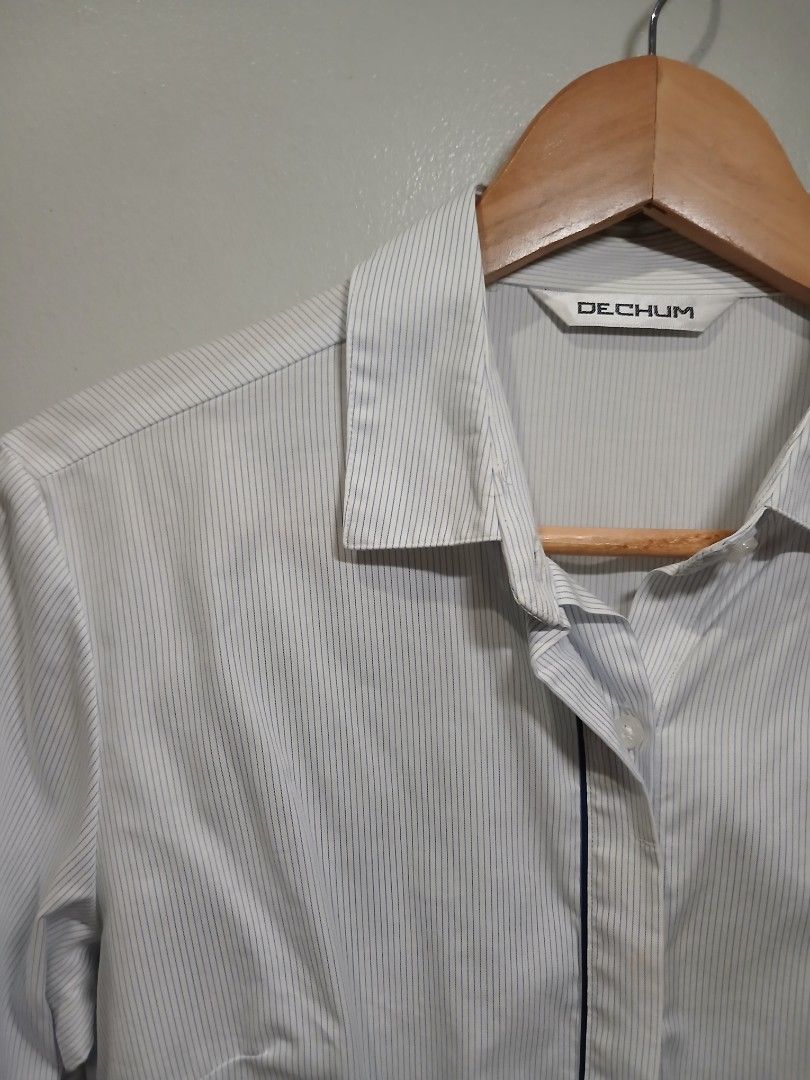 Striped long sleeve / Office wear (S-M) (Category: Longsleeves) located in Pasig City. Submitted by carmelaelizalde (Listing ID 1464737331, Image 2). Description: Color/Pattern: White with thin blue pinstripes Collar, front button closure, and button cuffs Hidden button, with snap every after buttons RFS: decluttering .