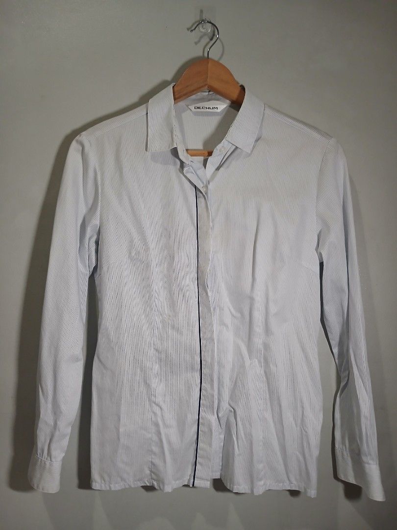 Striped long sleeve / Office wear (S-M) (Category: Longsleeves) located in Pasig City. Submitted by carmelaelizalde (Listing ID 1464737331, Image 1). Description: Color/Pattern: White with thin blue pinstripes Collar, front button closure, and button cuffs Hidden button, with snap every after buttons RFS: decluttering .