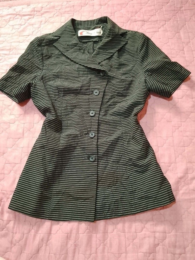 Striped Short Sleeve Blazer (Category: Blouses) located in Barobo. Submitted by angeljanet29035 (Listing ID 1464647691, Image 1). Description: - Short sleeve blazer - Pinstripe pattern - Button-up front - Collared neckline - Estimated size: Medium - Ideal for layering or wearing on its own - Versatile wardrobe addition.