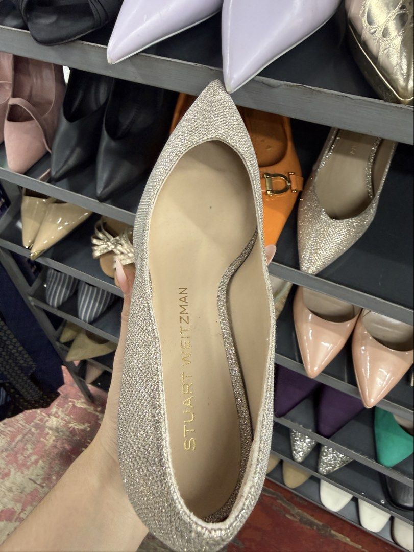 Stuart Weitzman Glitter Pointed Toe Kitten Heels (Category: Heels) located in Manila. Submitted by fastlion.584bdf (Listing ID 1464737063, Image 3). Description: - Brand: Stuart Weitzman - Style: Pointed toe stiletto kitten heels - Color/Finish: Champagne glitter with neutral nude lining - Details: Gold embossed logo on the insole - Occasion: Ideal for weddings, parties, and formal events - Condition: Excellent pre-loved condition (ready to wear)
