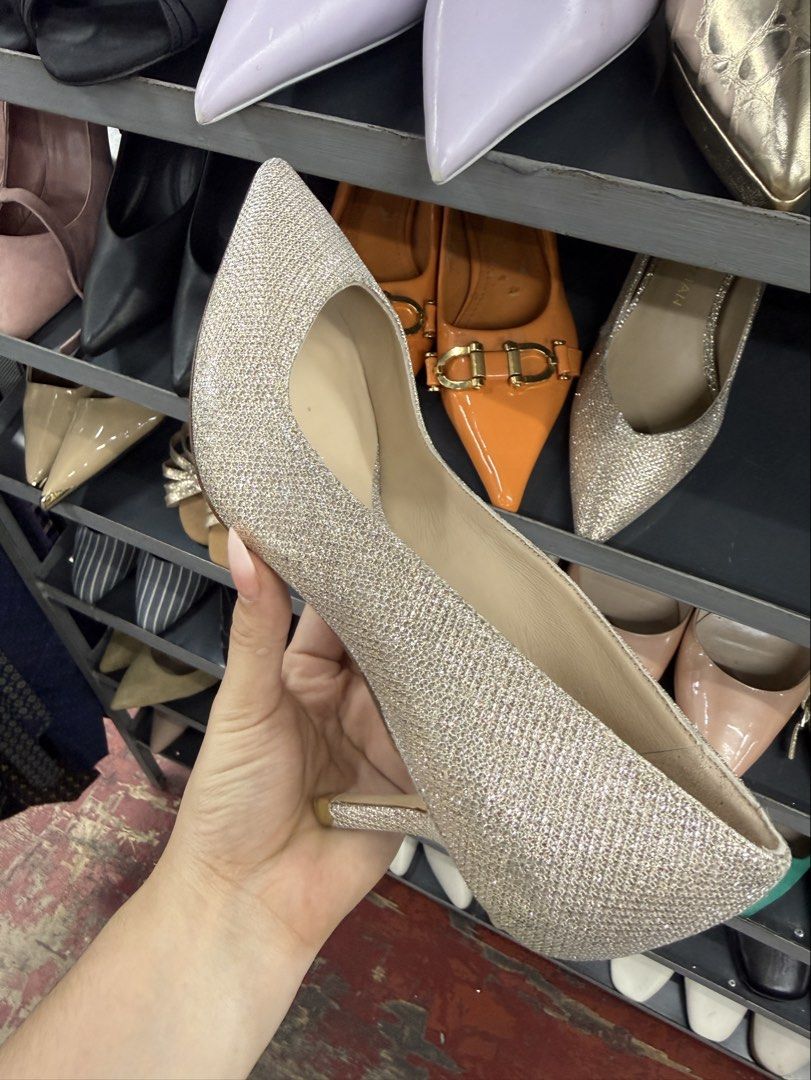 Stuart Weitzman Glitter Pointed Toe Kitten Heels (Category: Heels) located in Manila. Submitted by fastlion.584bdf (Listing ID 1464737063, Image 1). Description: - Brand: Stuart Weitzman - Style: Pointed toe stiletto kitten heels - Color/Finish: Champagne glitter with neutral nude lining - Details: Gold embossed logo on the insole - Occasion: Ideal for weddings, parties, and formal events - Condition: Excellent pre-loved condition (ready to wear)