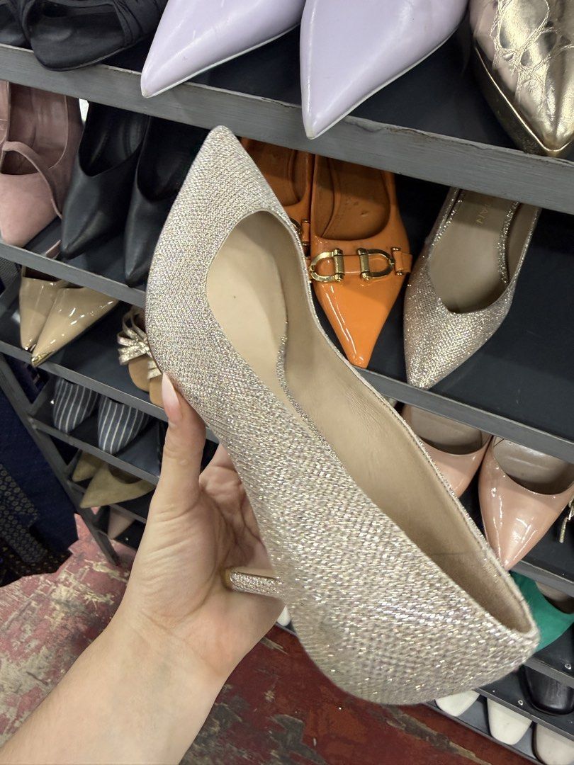 Stuart Weitzman Glitter Pointed Toe Kitten Heels (Category: Heels) located in Manila. Submitted by fastlion.584bdf (Listing ID 1464737063, Image 2). Description: - Brand: Stuart Weitzman - Style: Pointed toe stiletto kitten heels - Color/Finish: Champagne glitter with neutral nude lining - Details: Gold embossed logo on the insole - Occasion: Ideal for weddings, parties, and formal events - Condition: Excellent pre-loved condition (ready to wear)