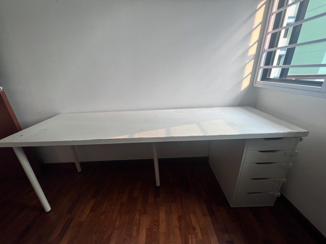 Study/work table (Category: Tables & Sets) located in Singapore. Submitted by abr143 (Listing ID 1464578972, Image 1). Description: white study or work table , lighlty used in good condition, light weight and has racks for storage.