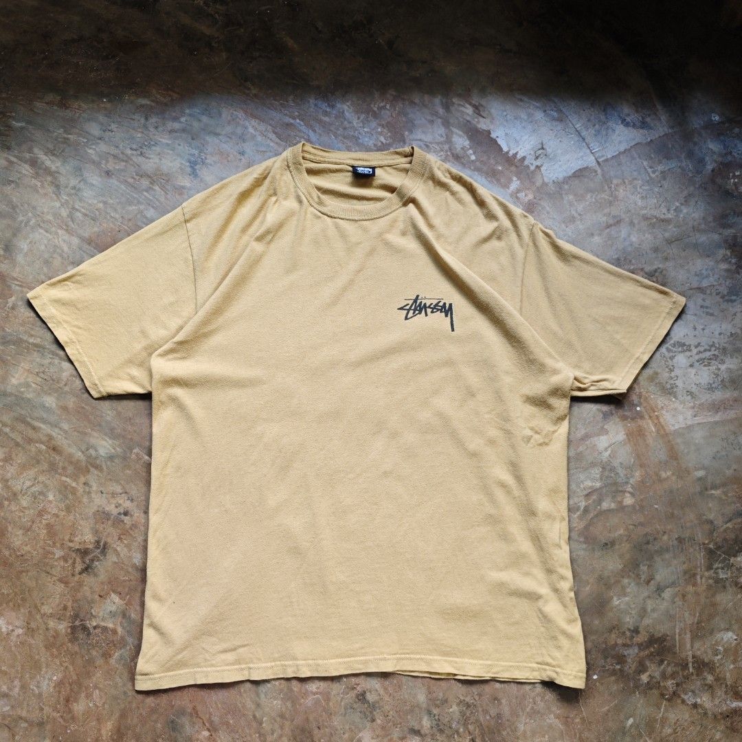 Stussy Big Link Tee 21SS (Category: Tshirts & Polo Shirts ) located in Ipil. Submitted by ajthriftfinds (Listing ID 1464637473, Image 2). Description: - Classic Stussy T-shirt - Color: Mustard Yellow - Size: Tagged XL - Design: Iconic Stussy logo on front, large circular logo on back - Material: 100% Cotton - Perfect for everyday wear.