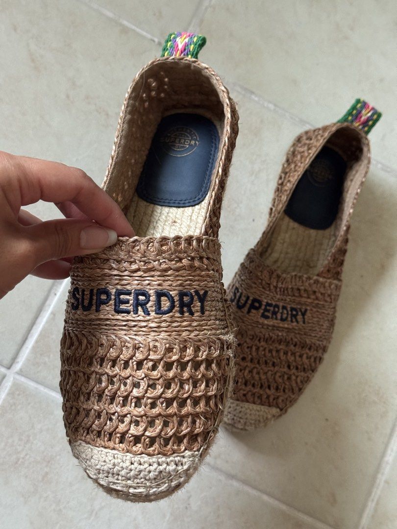 Superdry Crochet Espadrilles Brown Slip-On (Category: Flats & Sandals) located in Mandaluyong City. Submitted by missnaldo (Listing ID 1464715177, Image 2). Description: Superdry Slip-on crochet espadrilles Bought in Europe - Details: Embroidered Superdry logo on top and colorful patterned heel pull tab - Sole: Classic woven jute sole - Condition: Clean and well-maintained, only used in light walks - Perfect for: Casual warm-weather outfits and s
