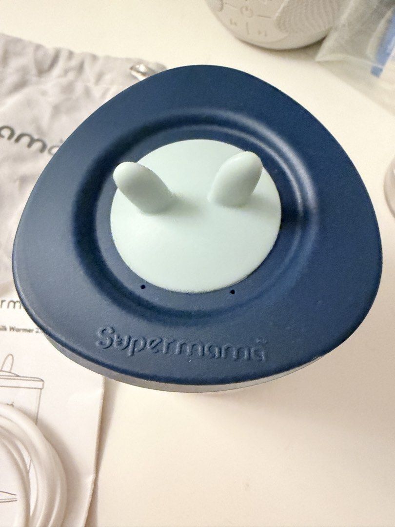 Supermama Portable Milk Warmer 2.0 with Pouch & USB Cable (Category: Breastfeeding & Bottle Feeding) located in Manila. Submitted by mmlb07 (Listing ID 1464640690, Image 3). Description: Supermama Portable Milk Warmer 2.0. Comes with a storage pouch and USB charging cable. The lid has cute bunny ears. Great for warming milk on the go. Easy to use with a simple button interface. Compact and convenient for travel. Never been used - just no box incl