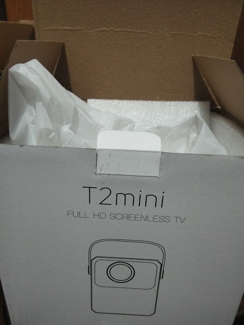 T2mini Full HD Screenless TV Projector with Remote (Category: Projectors) located in Caloocan City. Submitted by xelauy090386113 (Listing ID 1464595445, Image 3). Description: - T2mini Full HD Projector - Functions as a screenless TV - Ideal for movie nights and presentations - Includes remote control - Includes user manual - Power adapter included - Compact and user-friendly design.