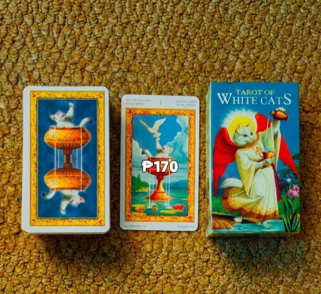 Tarot of White Cats Deck (Category: Educational & Learning Toys) located in Pinamalayan. Submitted by dot.e (Listing ID 1464575513, Image 1). Description: Still new. Opened and Unused. All complete cards. J&T or LBC shipping Sf shouldered by the buyer Location: Pinamalayan, Oriental Mindoro.