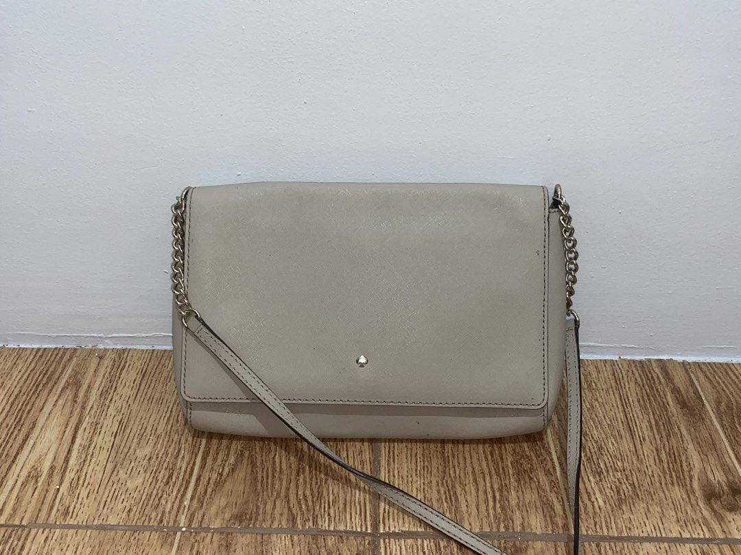 TAUPE FLAP CROSSBODY BAG (Category: Cross-body Bags) located in Davao. Submitted by ccfinds_ph (Listing ID 1464692428, Image 3). Description: Condition: Rank B - Good. Moderately used. Exterior is in good condition with minimal signs of use and one light scuff mark at the back. Signature logo on front flap. Interior features monogram lining with zip pocket and slip pocket. Magnetic snap closure. Can be worn as crossbody or clutch. Price is negoti