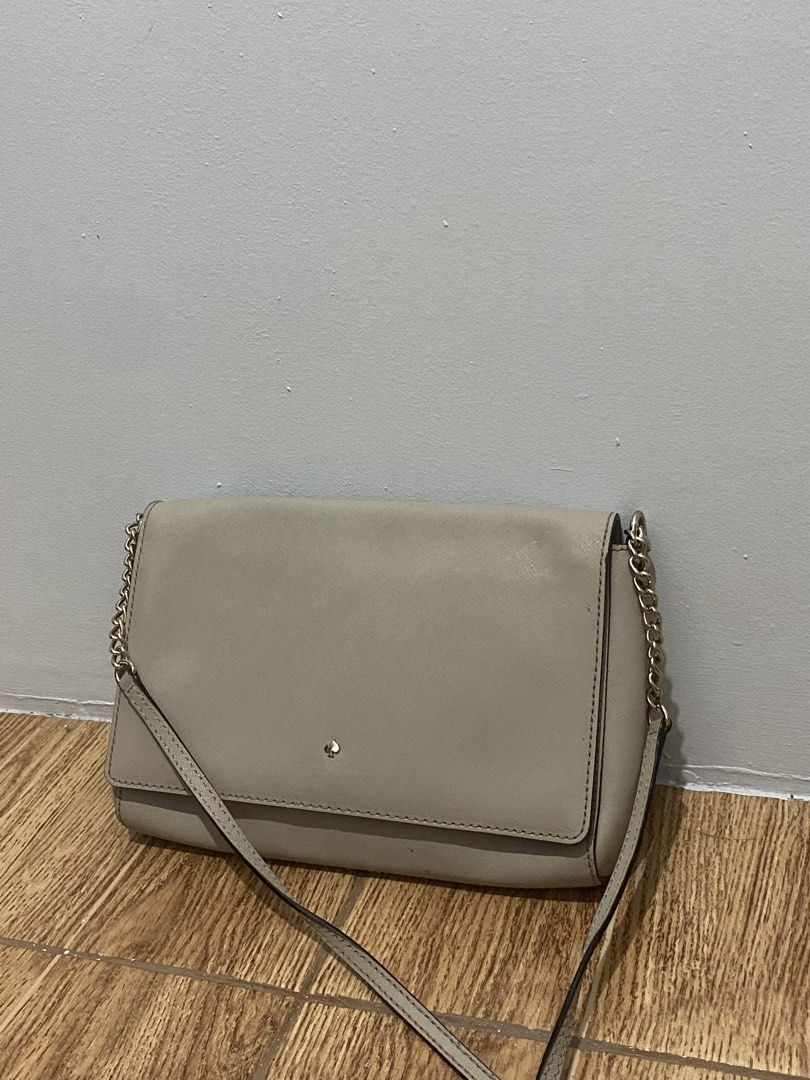 TAUPE FLAP CROSSBODY BAG (Category: Cross-body Bags) located in Davao. Submitted by ccfinds_ph (Listing ID 1464692428, Image 2). Description: Condition: Rank B - Good. Moderately used. Exterior is in good condition with minimal signs of use and one light scuff mark at the back. Signature logo on front flap. Interior features monogram lining with zip pocket and slip pocket. Magnetic snap closure. Can be worn as crossbody or clutch. Price is negoti