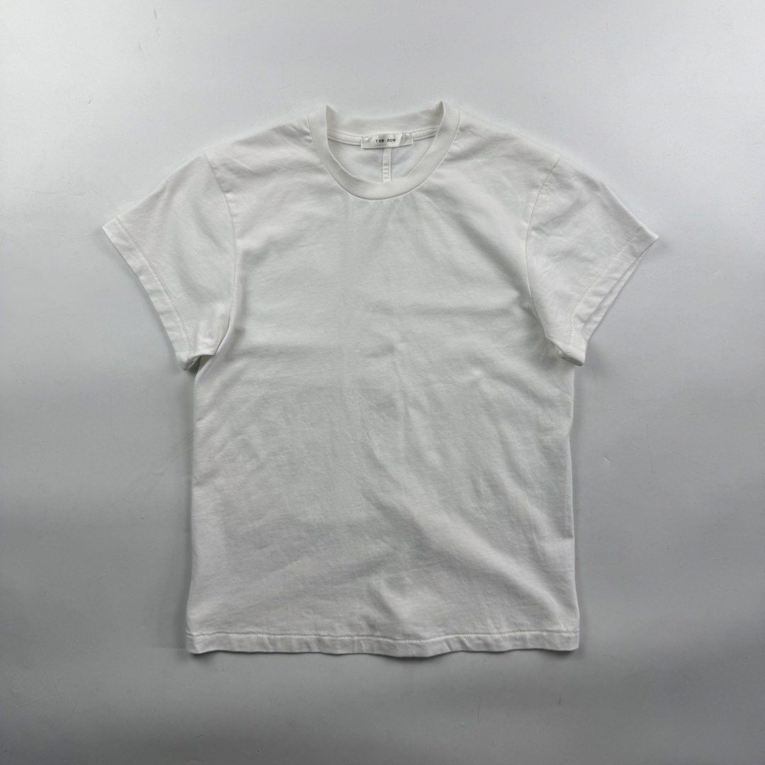 The Row Calibi T-Shirt (Category: Shirts) located in Manila. Submitted by jademax (Listing ID 1464732997, Image 1). Description: Size Large Length: 20” Pit: 16” Shoulder: 13.5” Sleeve: 5”.