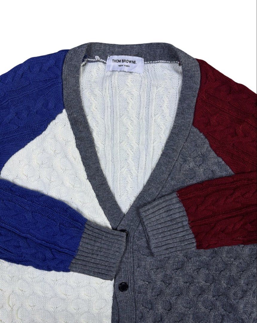 Thom Browne Patchwork Cable Knit Cardigan (Category: Coats, Jackets and Outerwear) located in Zamboanga. Submitted by nurhosinna77344 (Listing ID 1464585432, Image 2). Description: Thom Browne cardigan with a unique patchwork design. Features a mix of cable knit patterns in white, grey, blue, and burgundy. Two front pockets. Button closure. Made from 95% cotton and 5% polyurethane..