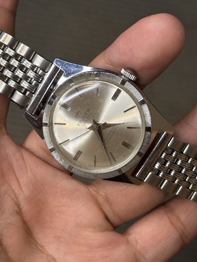 Thoyer De Luxe (Hand-winding) (Category: Men's Watches) located in Manila. Submitted by soughtafterseconds (Listing ID 1464730711, Image 2). Description: Thoyer De Luxe (Hand-winding) This vintage Thoyer De Luxe Champagne Sunburst Mechanical Watch is a handsome piece of late-1960s to 1970s European dress horology, featuring a textured engine-turned bezel and a classic multi-link beads-of-rice bracelet. Framed by a knurled / engine-turned coin-edg