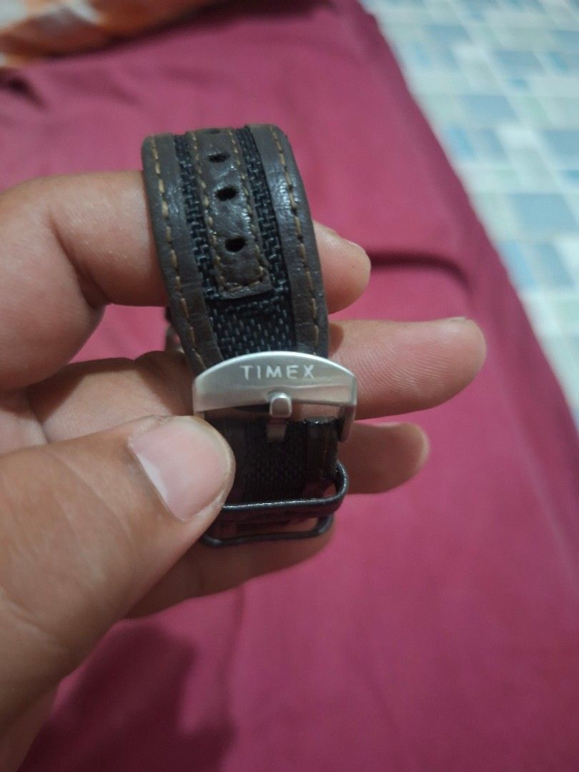 Timex Expedition Watch with Leather and Nylon Strap (Category: Men's Watches) located in Lapu Lapu. Submitted by margaux099 (Listing ID 1464658986, Image 3). Description: - Timex Expedition watch - Grey dial with clear numbers and date window - Water resistant up to 50 meters - Stainless steel back - Comes with dark brown leather strap and black nylon strap - Buckle closure - Ideal for everyday wear and outdoor adventures.