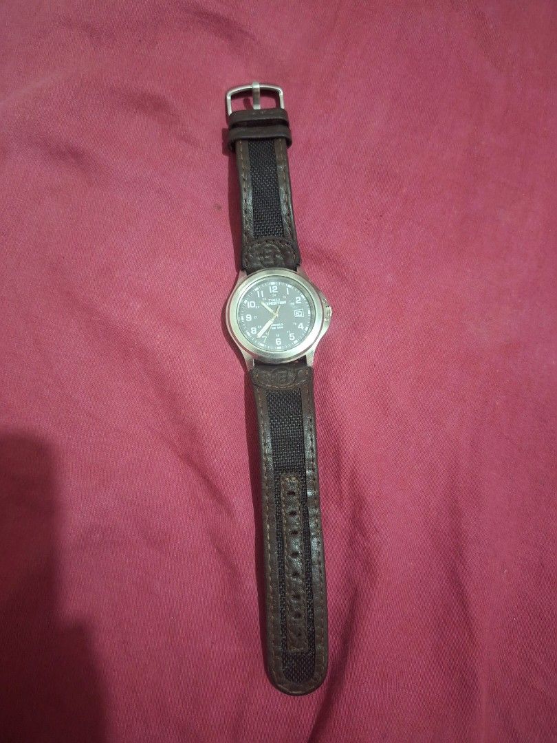 Timex Expedition Watch with Leather and Nylon Strap (Category: Men's Watches) located in Lapu Lapu. Submitted by margaux099 (Listing ID 1464658986, Image 1). Description: - Timex Expedition watch - Grey dial with clear numbers and date window - Water resistant up to 50 meters - Stainless steel back - Comes with dark brown leather strap and black nylon strap - Buckle closure - Ideal for everyday wear and outdoor adventures.
