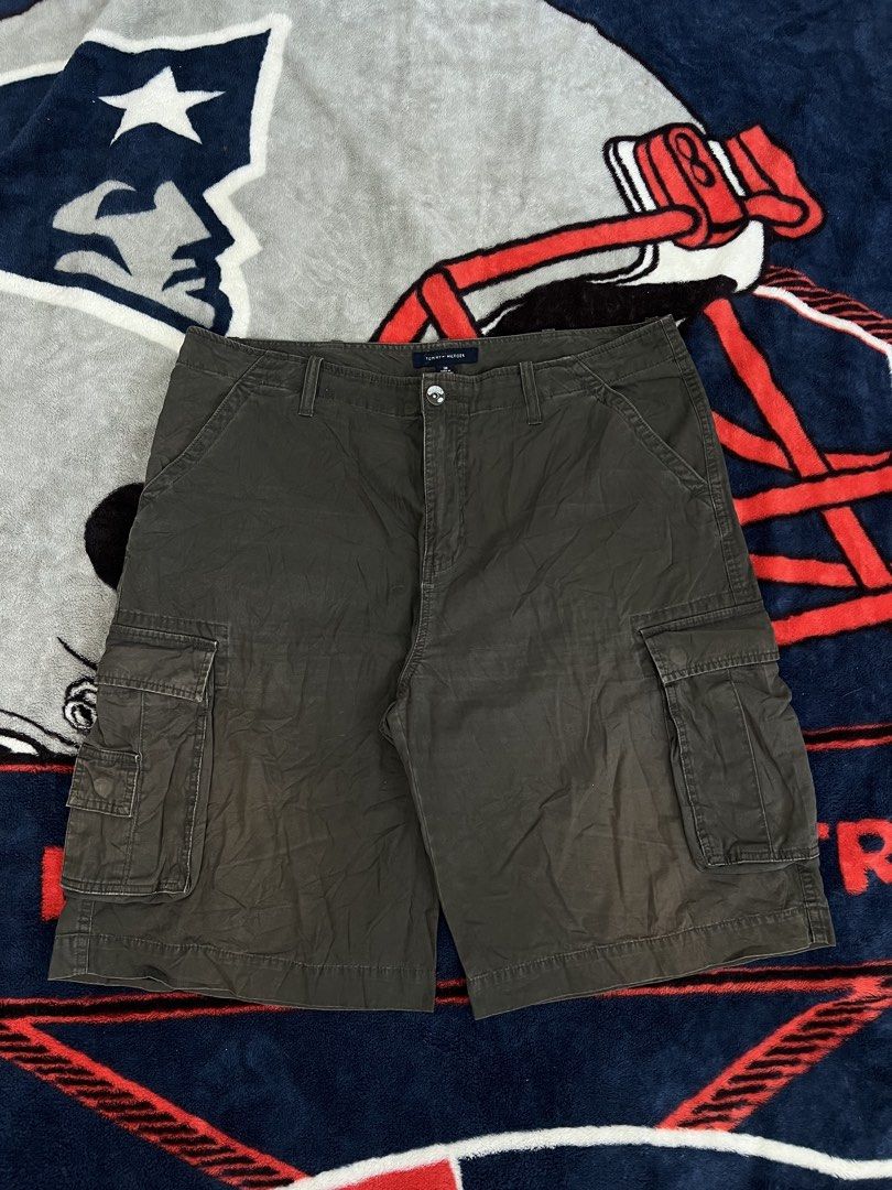 Tommy Hilfiger Cargo Shorts Size 36 Khaki (Category: Shorts) located in Tanza. Submitted by 1954_street (Listing ID 1464580413, Image 1). Description: TOMMY CARGO 38 waist 25 length 14 leg op minor fade part - Brand: Tommy Hilfiger - Color: Khaki - Size: 36 - Style: Cargo shorts - Features: Multiple pockets for ample storage - Closure: Button and zip fly - Additional: Belt loops - Ideal for: Casual wear, outdoor activities, everyday use.