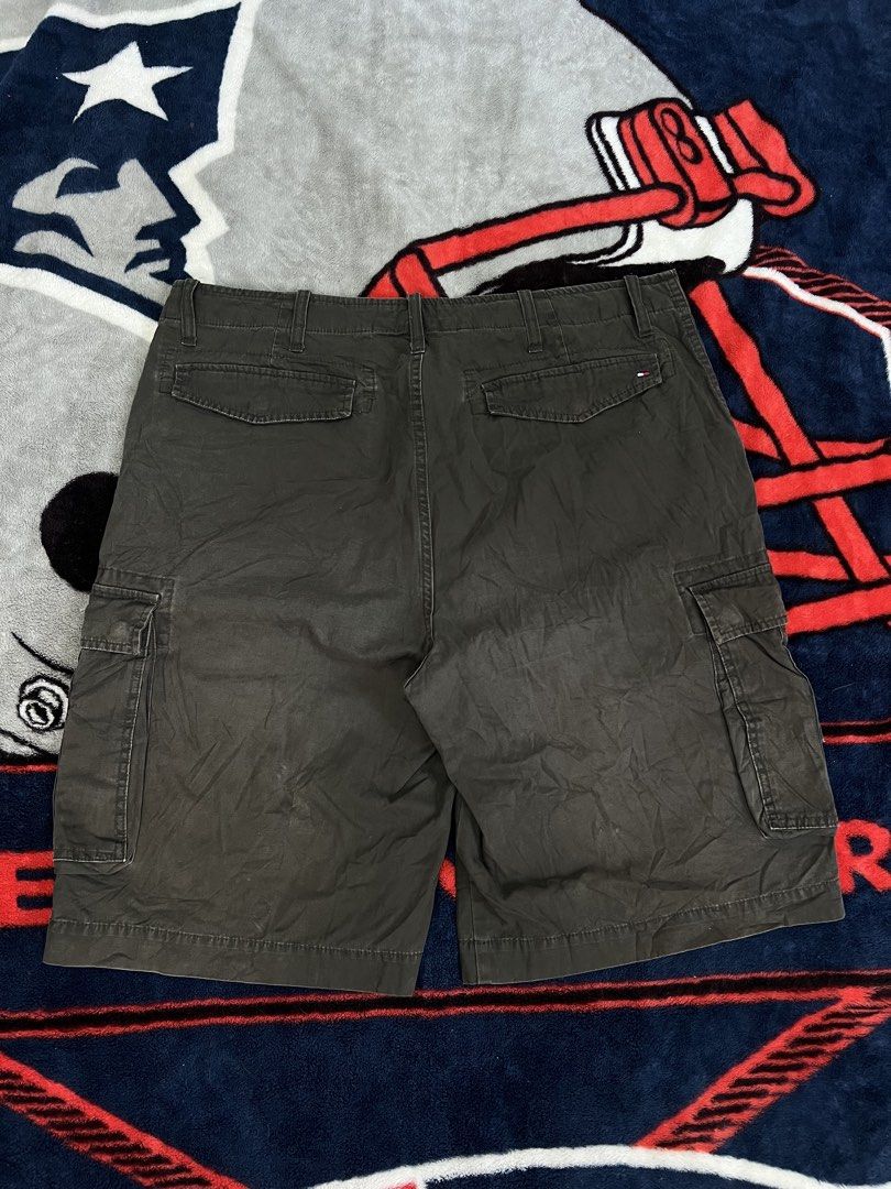 Tommy Hilfiger Cargo Shorts Size 36 Khaki (Category: Shorts) located in Tanza. Submitted by 1954_street (Listing ID 1464580413, Image 3). Description: TOMMY CARGO 38 waist 25 length 14 leg op minor fade part - Brand: Tommy Hilfiger - Color: Khaki - Size: 36 - Style: Cargo shorts - Features: Multiple pockets for ample storage - Closure: Button and zip fly - Additional: Belt loops - Ideal for: Casual wear, outdoor activities, everyday use.