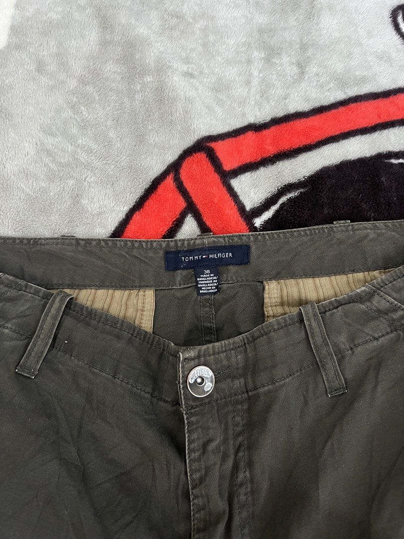 Tommy Hilfiger Cargo Shorts Size 36 Khaki (Category: Shorts) located in Tanza. Submitted by 1954_street (Listing ID 1464580413, Image 2). Description: TOMMY CARGO 38 waist 25 length 14 leg op minor fade part - Brand: Tommy Hilfiger - Color: Khaki - Size: 36 - Style: Cargo shorts - Features: Multiple pockets for ample storage - Closure: Button and zip fly - Additional: Belt loops - Ideal for: Casual wear, outdoor activities, everyday use.