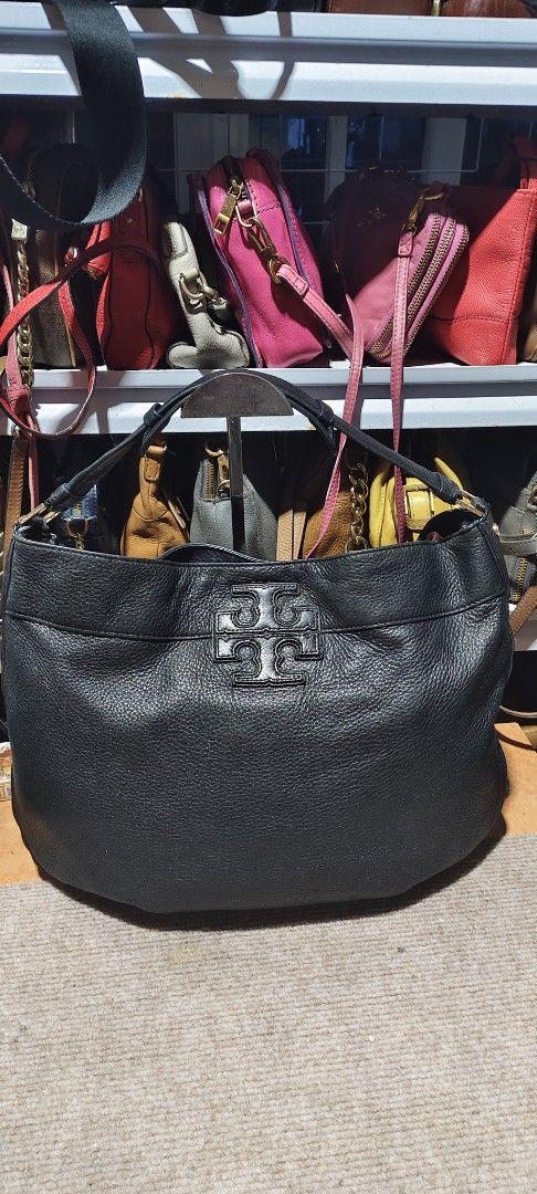 Tory Burch Black Leather Tote Bag (Category: Tote Bags) located in Solano. Submitted by chie_prelovedthriftshop (Listing ID 1464630897, Image 1). Description: Black leather Tory Burch tote bag. Spacious interior. Comfortable shoulder straps. Embossed Tory Burch logo on the front. Great everyday bag. Some signs of wear on the leather and hardware. needs wash inside.