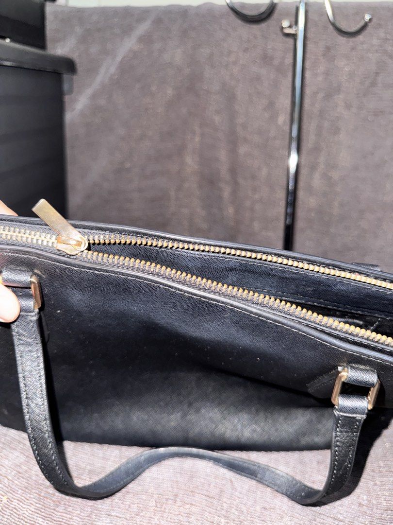Tory Burch Black Leather Tote Bag (Category: Tote Bags) located in Manila. Submitted by dearpinkcollections (Listing ID 1464678491, Image 2). Description: - Classic black Tory Burch tote bag - Durable saffiano leather exterior - Elegant gold hardware details - Secure zipper closure for main compartment - Signature Tory Burch logo lining inside - Ample space for essentials - Ideal for work or everyday carry -No sling -minimal leather issue sa band