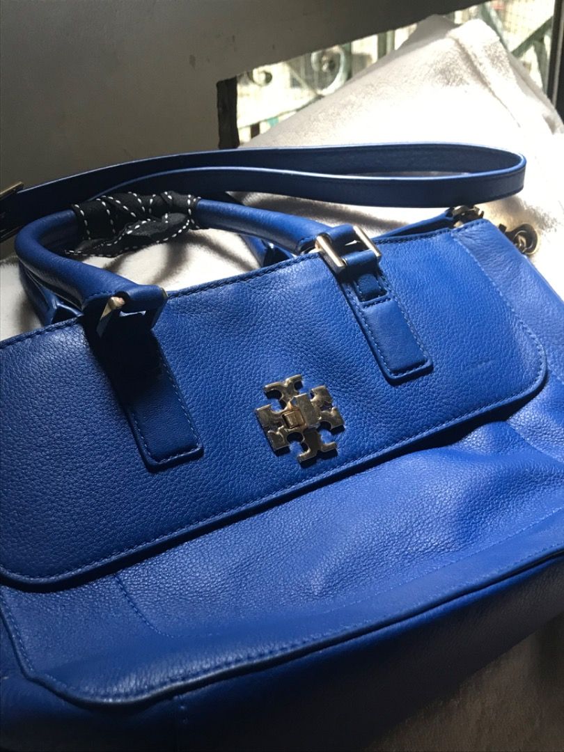 Tory Burch Royal Blue Leather Tote Bag (Category: Tote Bags) located in Manila. Submitted by jeji1208 (Listing ID 1464589221, Image 3). Description: - Authentic Tory Burch leather tote bag - Stunning royal blue color - Iconic gold Tory Burch logo on the front - Versatile carrying options: top handles and detachable shoulder strap - Spacious interior for all your essentials - Chic detail: small black and white ribbon tied to one handle.