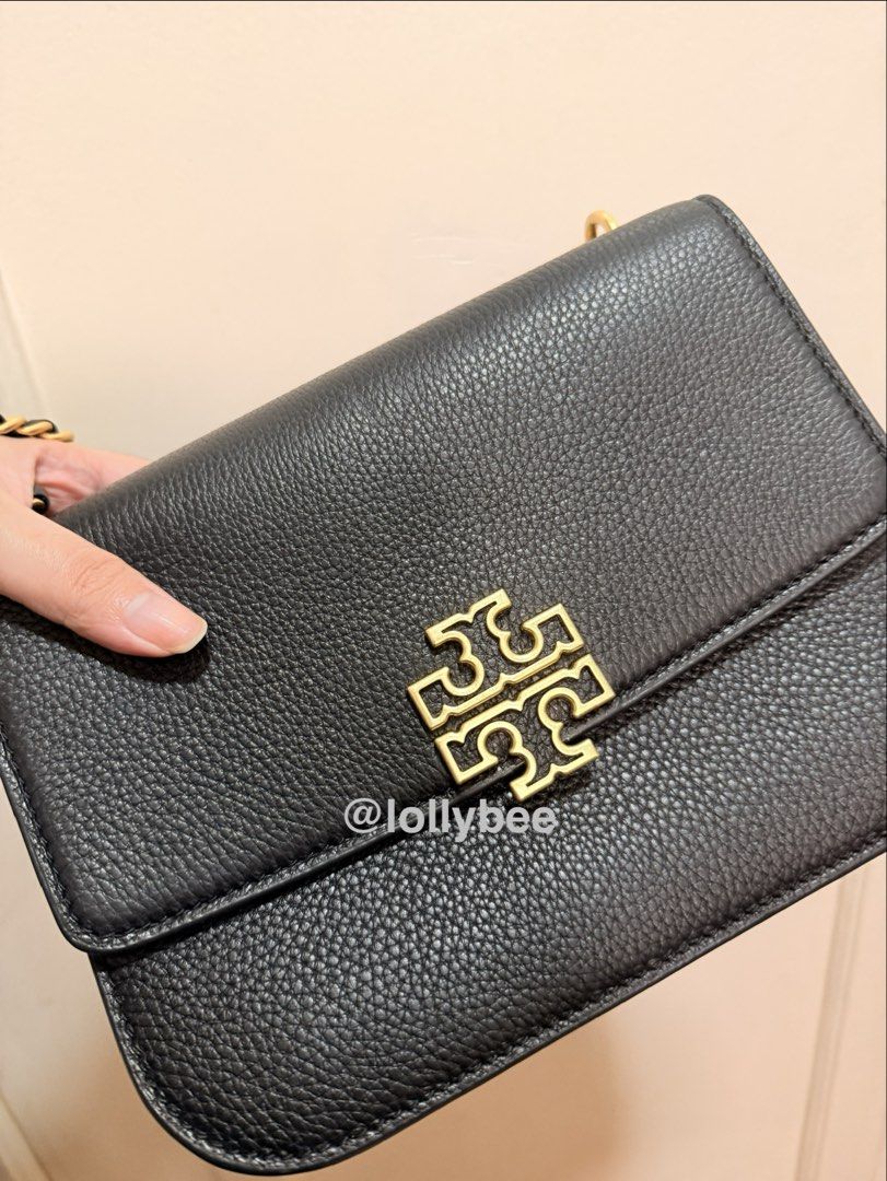 Tory Burch Small Britten Two-way Bag (Category: Luxury Bags & Wallets) located in Pasig City. Submitted by lollybee (Listing ID 1464754686, Image 1). Description: Authentic bag bought from pasabuy (@allaboutstuff.ph) at P15k. I can show you our convo if needed. Selling low because it’s not being used (too small for my needs). Sayang naman. Please be reasonable if you will haggle. - Material: Black pebbled leather - Hardware: Gold-tone hardware wi