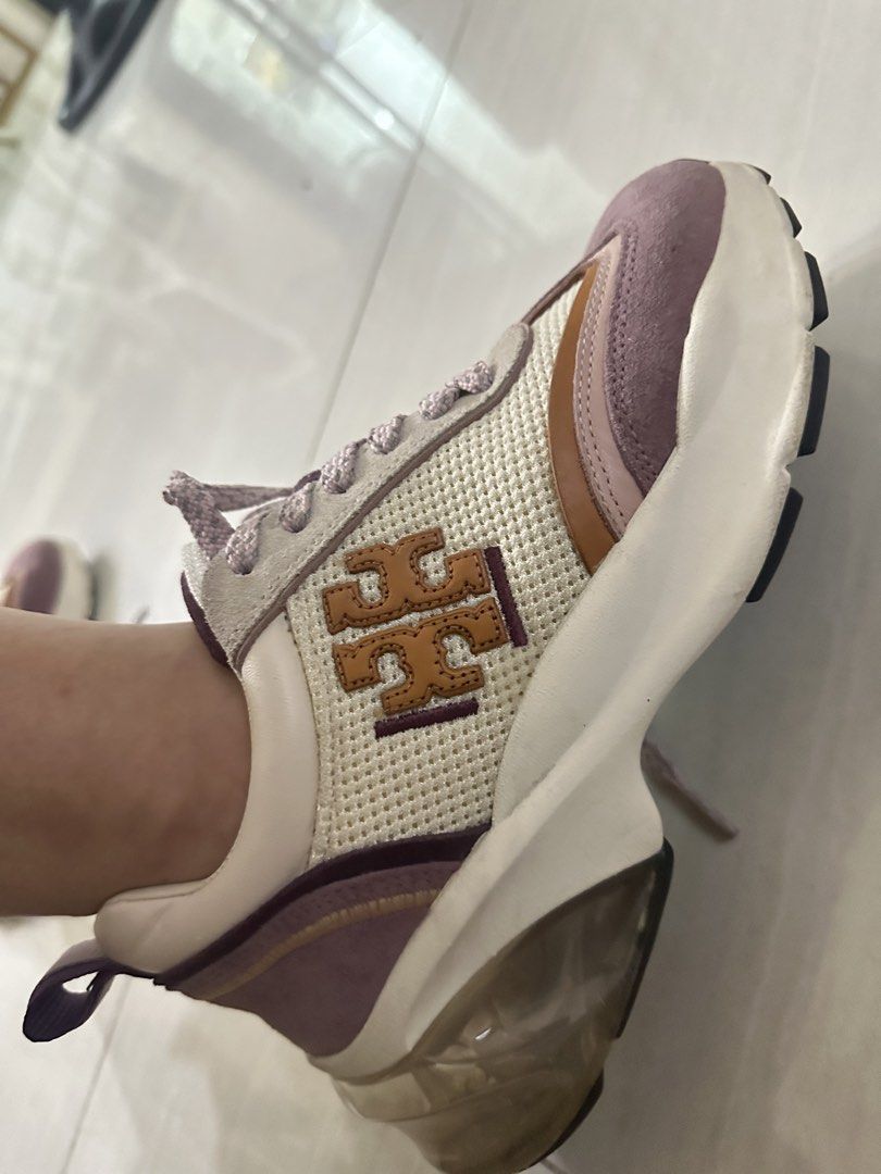 Tory Burch sneakers (Category: Sneakers) located in Bulacan. Submitted by louiseee23 (Listing ID 1464639994, Image 2). Description: - Brand: Tory Burch - Color: Cream, Purple, Brown - Style: Lace-up sneakers - Features: Signature Tory Burch logo on the side, chunky sole, unique clear heel detail - Perfect for: Casual wear.