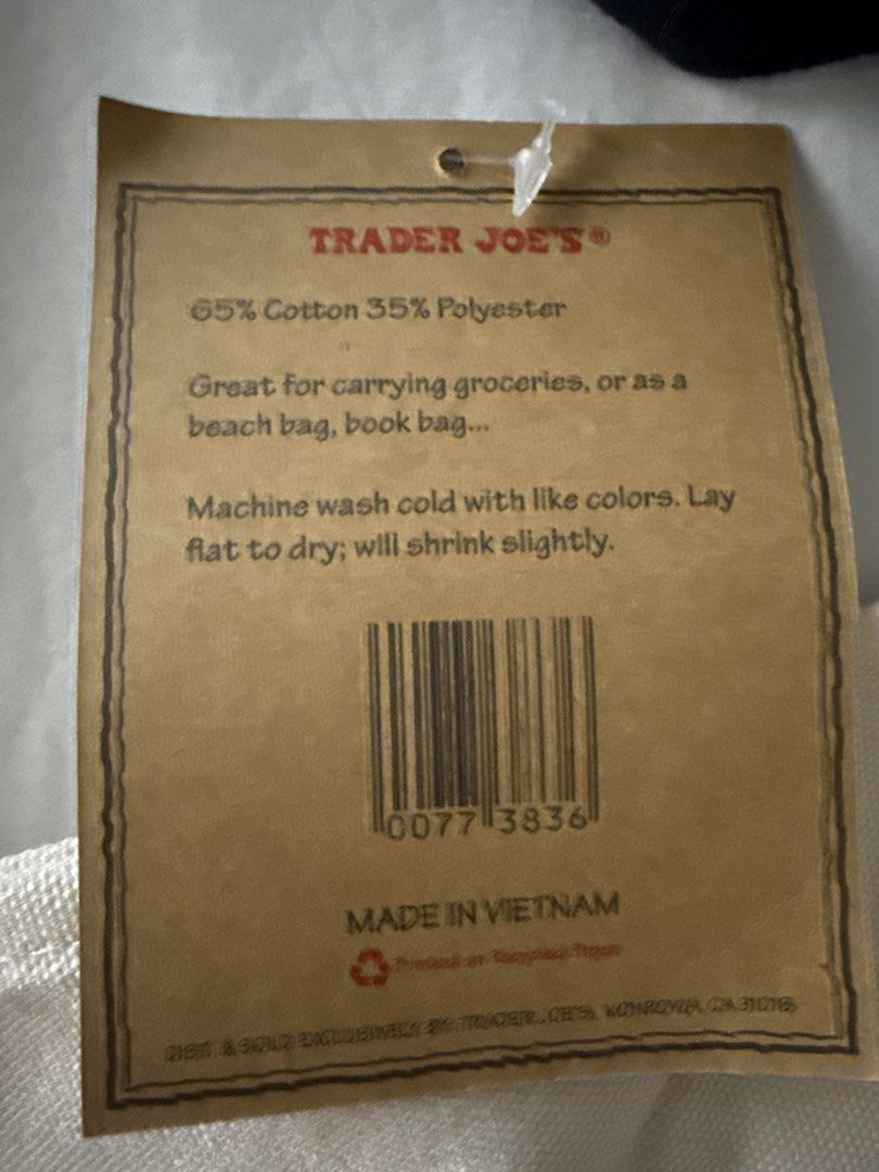 Trader Joe's Reusable Canvas Tote Bag (Category: Tote Bags) located in Quezon City. Submitted by olrac23 (Listing ID 1464642327, Image 2). Description: - Trader Joe's Reusable Tote Bag - Material: 65% Cotton, 35% Polyester - Versatile Use: Groceries, beach trips, book bag - Care Instructions: Machine wash cold with like colors - Drying: Lay flat to dry (expect slight shrinkage) - Origin: Made in Vietnam.