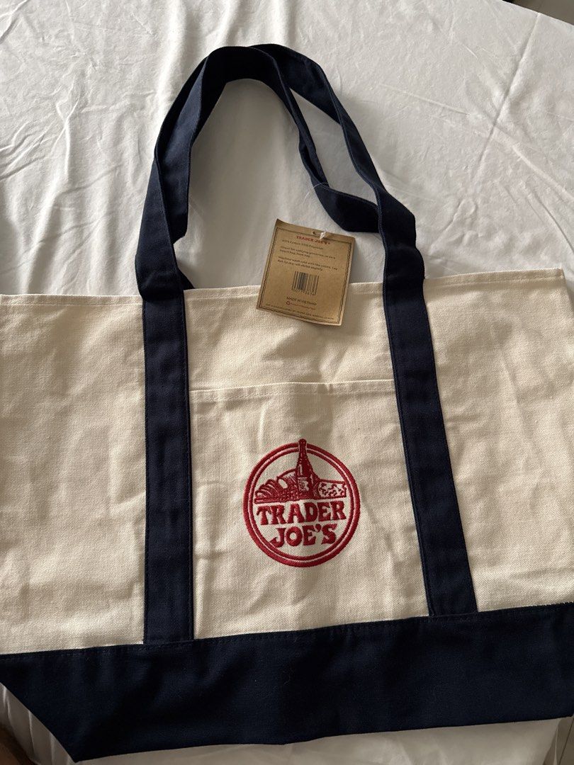Trader Joe's Reusable Canvas Tote Bag (Category: Tote Bags) located in Quezon City. Submitted by olrac23 (Listing ID 1464642327, Image 1). Description: - Trader Joe's Reusable Tote Bag - Material: 65% Cotton, 35% Polyester - Versatile Use: Groceries, beach trips, book bag - Care Instructions: Machine wash cold with like colors - Drying: Lay flat to dry (expect slight shrinkage) - Origin: Made in Vietnam.