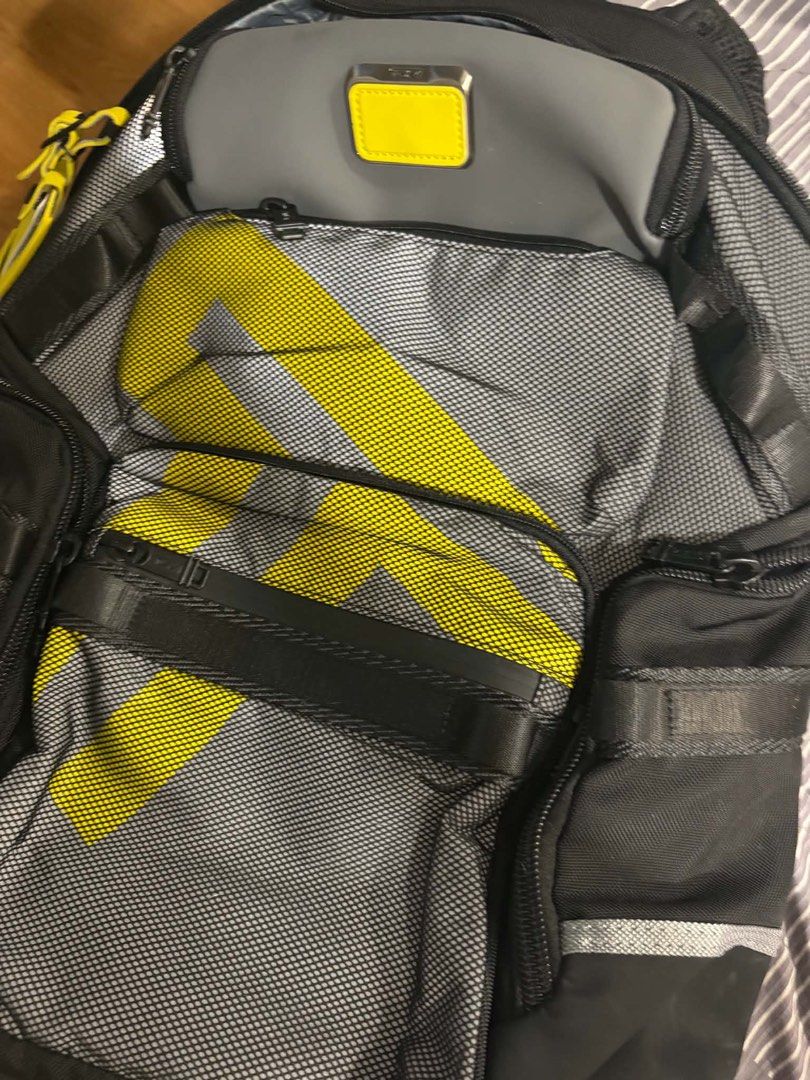 TUMI Alpha Bravo Navigation Backpack Reflective T 159071A867 (Category: Backpacks) located in Mandaluyong City. Submitted by shopwithjuu (Listing ID 1464701036, Image 1). Description: Authentic TUMI Alpha Bravo Navigation Backpack in the rare Reflective T colorway (Style 159071A867). Features a modern yellow and grey mesh design, bright yellow accents, and multiple compartments. Retails around HK$7,600. Personal preloved Rfs: bought another one w