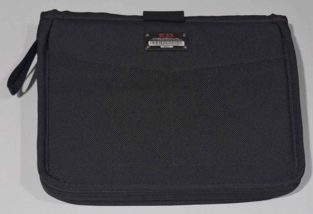 Tumi Black Nylon Laptop Sleeve (Category: Laptop Bags & Sleeves) located in Makati City. Submitted by decluttermp (Listing ID 1464606311, Image 2). Description: - Brand: TUMI - Color: Black - Material: Nylon - Dimensions: L - in x W - x D - - Features: Front pocket, strap closure - Compatibility: Fits 13 inch MacBook Air - Function: Protects your device - Design: Clean and simple.
