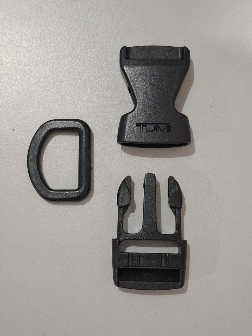 TUMI plastic buckle set with D-Ring (Category: Backpacks) located in Makati City. Submitted by decluttermp (Listing ID 1464572083, Image 2). Description: - Genuine TUMI buckle set - Includes: 1 side-release buckle, 1 D-ring - Material: Durable black plastic Ideal for replacing broken bag buckles - Great for Tumi bag repairs.