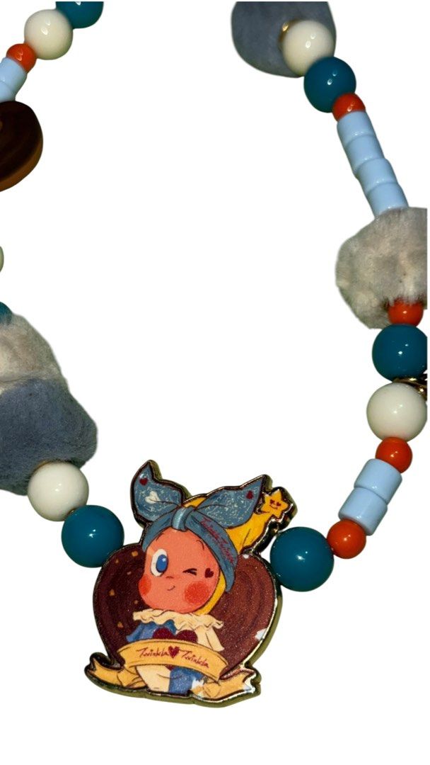 Twinkle Twinkle Beaded Phone Strap Keychain Charm (Category: Charms) located in Baguio. Submitted by zeemoda01 (Listing ID 1464716673, Image 2). Description: - Brand: Twinkle Twinkle (Brand tag still attached) - Design: Colorful beads in blue, white, and orange with fluffy grey and white pom-poms - Charms: Includes a heart pendant with 'Don't stop imagining' and an adorable cartoon character charm - Hardware: Secure gold-tone keyring - Condition: