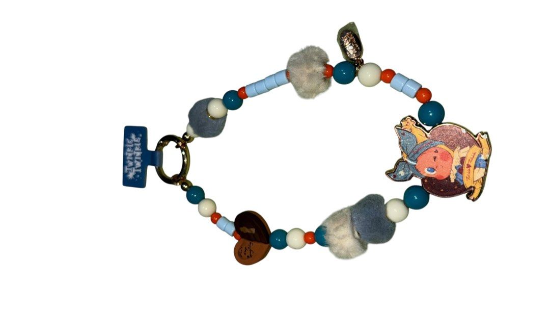 Twinkle Twinkle Beaded Phone Strap Keychain Charm (Category: Charms) located in Baguio. Submitted by zeemoda01 (Listing ID 1464716673, Image 3). Description: - Brand: Twinkle Twinkle (Brand tag still attached) - Design: Colorful beads in blue, white, and orange with fluffy grey and white pom-poms - Charms: Includes a heart pendant with 'Don't stop imagining' and an adorable cartoon character charm - Hardware: Secure gold-tone keyring - Condition: