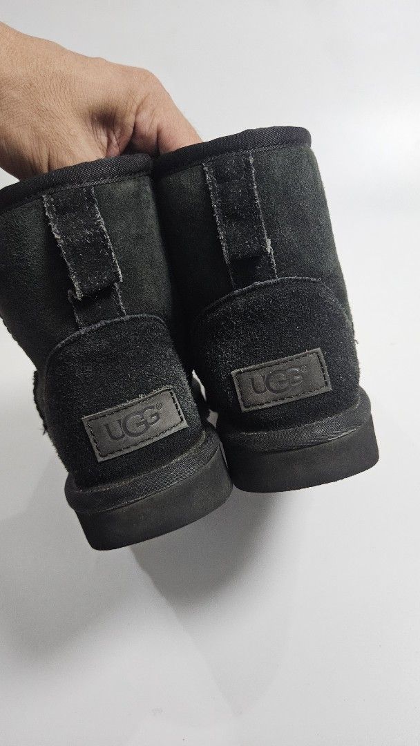 UGG Australia Black Suede Sheepskin Boots (Category: Boots) located in Alfonso. Submitted by jbcamet (Listing ID 1464604859, Image 2). Description: - Black UGG boots - Material: Suede exterior, Sheepskin lining - Size: EU 38 - Features: Comfortable and warm, ideal for cooler days - Condition: Soles show some wear, but plenty of life left - Style: Great for casual wear.