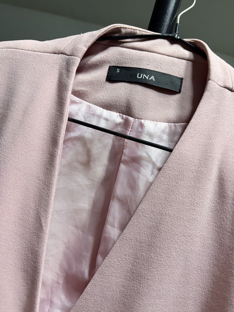 UNA Pink Double Breasted Blazer Size S (Category: Coats, Jackets and Outerwear) located in Manila. Submitted by finderskeepersmnl_092026 (Listing ID 1464746006, Image 2). Description: - Brand/Model: UNA Pink Blazer - Size: Small (S) - Design: Double-breasted with elegant gold-tone buttons - Cut: Collarless V-neck with structured shoulders and long sleeves - Pockets: Functional front welt pockets - Interior: Fully lined with matching lighter pink 