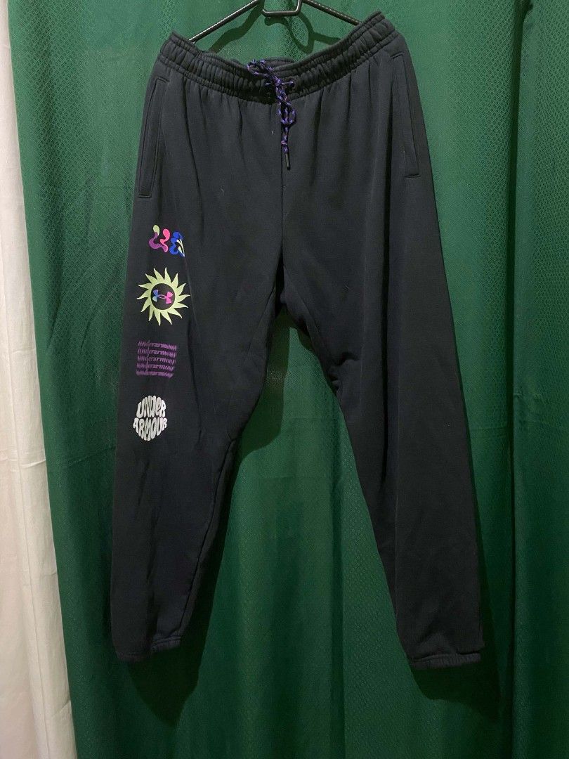 Under Armour Black Graphic Sweatpants XXL (Category: Joggers) located in Quezon City. Submitted by elihur.tuazon (Listing ID 1464736585, Image 3). Description: - Brand: Under Armour - Size: XXL (Plus size) - Color: Black fleece - Details: Multicolored speckled drawstring, side pockets, ribbed ankle cuffs - Graphic: Fun colorful sun motif and distorted UA text on the right leg - Origin: Made in Malaysia - Condition: Great for lounging, workouts, a