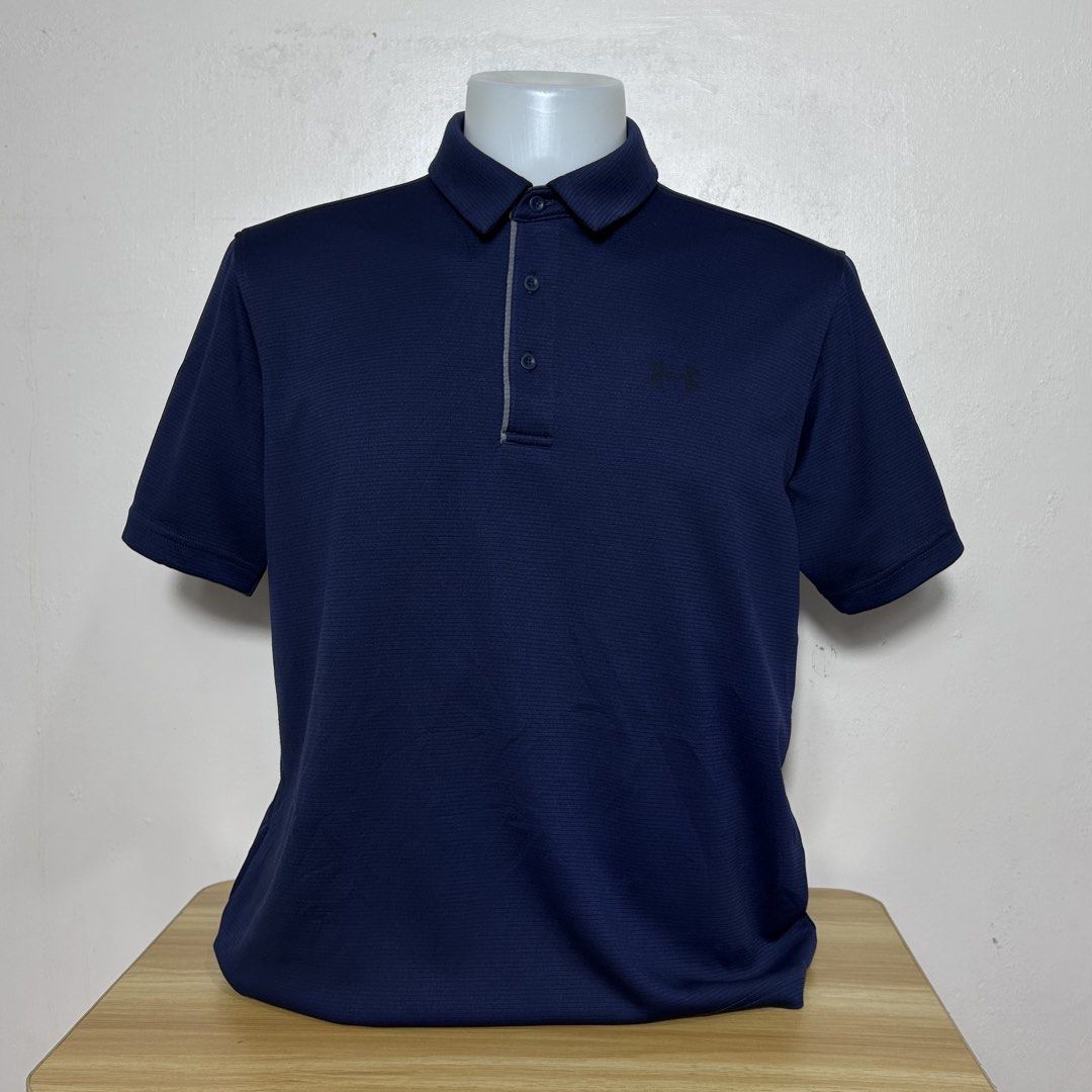 Under Armour Navy Blue Polo Shirt (Category: Tshirts & Polo Shirts ) located in Dipolog. Submitted by edthrfts (Listing ID 1464707867, Image 1). Description: ✅ ALREADY WASHED AND SANITIZED 📐Width: 22.5 📐Length: 26.5 Fit to: XL-2XL Condition: 9.5/10 Color: 9.8/10 Issue: fade print sa front and minimal hairline sa back.