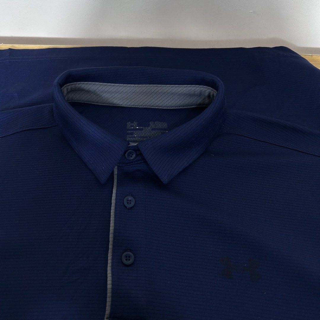 Under Armour Navy Blue Polo Shirt (Category: Tshirts & Polo Shirts ) located in Dipolog. Submitted by edthrfts (Listing ID 1464707867, Image 3). Description: ✅ ALREADY WASHED AND SANITIZED 📐Width: 22.5 📐Length: 26.5 Fit to: XL-2XL Condition: 9.5/10 Color: 9.8/10 Issue: fade print sa front and minimal hairline sa back.