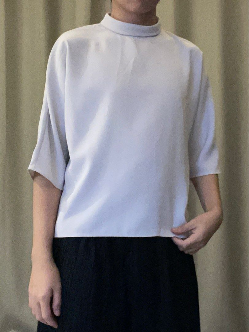 Uniqlo Chic White Mock Neck Blouse - Chic Minimalist (Category: Blouses) located in Bacolod City. Submitted by fka.tims (Listing ID 1464701491, Image 3). Description: White Still Available! 🤍 🦢 Purple is Taken 🚫 Fits S-M, Relaxed fit Brand new with tags 🏷️ Measurements in pics 📏.
