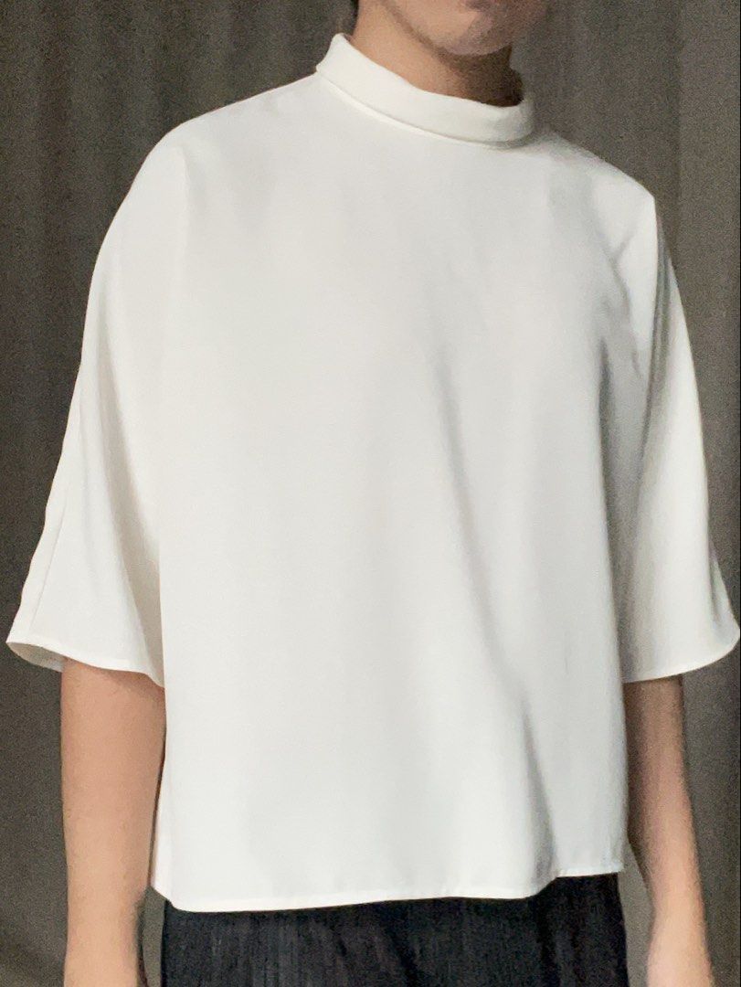 Uniqlo Chic White Mock Neck Blouse - Chic Minimalist (Category: Blouses) located in Bacolod City. Submitted by fka.tims (Listing ID 1464701491, Image 1). Description: White Still Available! 🤍 🦢 Purple is Taken 🚫 Fits S-M, Relaxed fit Brand new with tags 🏷️ Measurements in pics 📏.