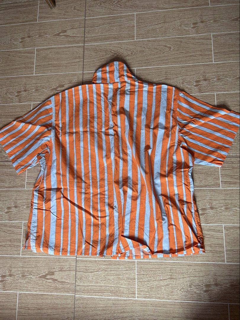 UNIQLO orange stripes polo (Category: Blouses) located in Malabon City. Submitted by segccola (Listing ID 1464742120, Image 2). Description: - Size: Small on tag - Fits: S–M depending on preferred fit - Pre-loved, only worn a few times - minimal stains on the collar - complete buttons RFS: Decluttering + not really my style MOP: Gcash/Maya.