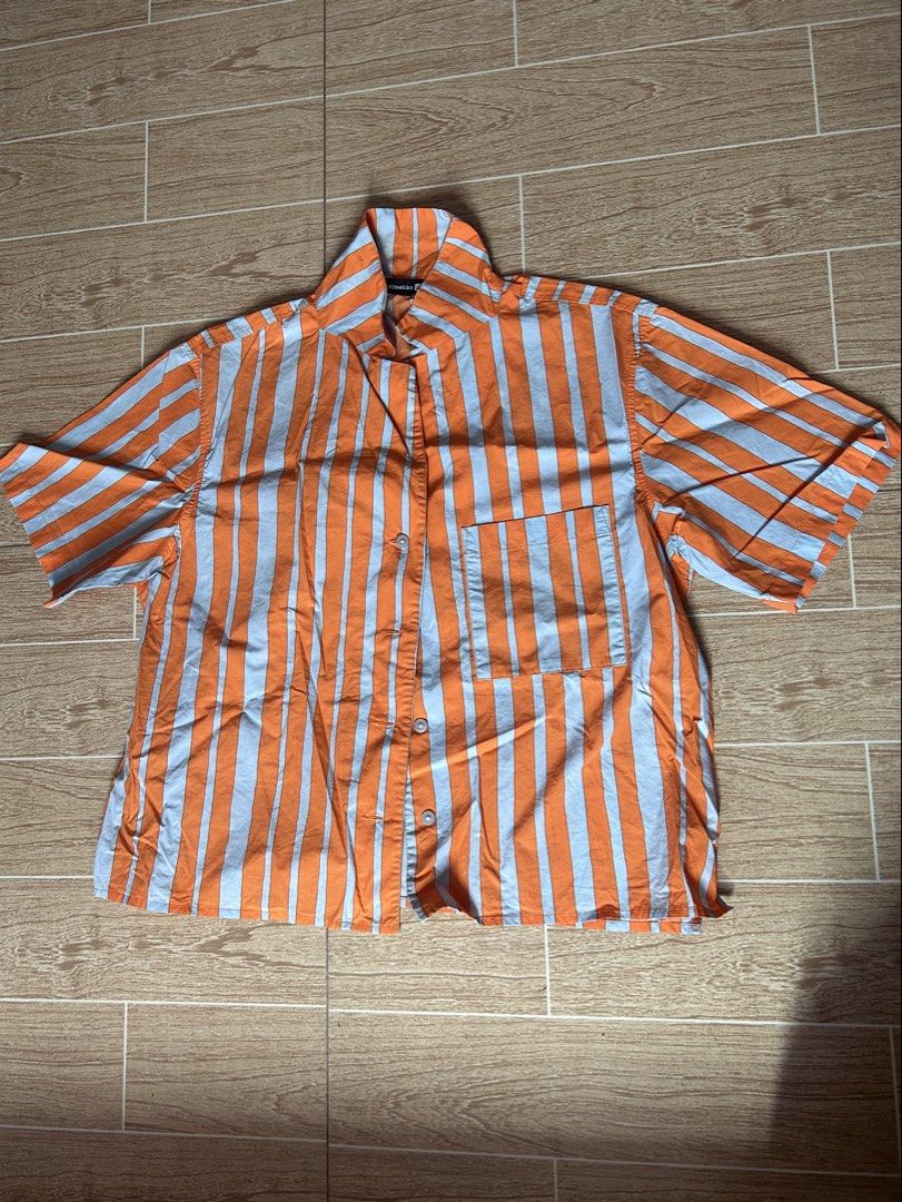 UNIQLO orange stripes polo (Category: Blouses) located in Malabon City. Submitted by segccola (Listing ID 1464742120, Image 1). Description: - Size: Small on tag - Fits: S–M depending on preferred fit - Pre-loved, only worn a few times - minimal stains on the collar - complete buttons RFS: Decluttering + not really my style MOP: Gcash/Maya.