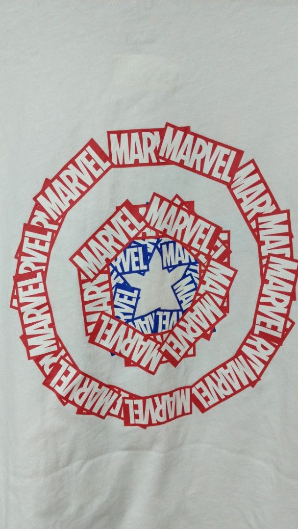 Uniqlo UT Marvel Captain America (Category: Tshirts & Polo Shirts ) located in Manila. Submitted by zariyah.1986 (Listing ID 1464756793, Image 3). Description: - Brand/Collection: Uniqlo UT x Marvel - Design: White tee with front red box logo and large Captain America shield back graphic (made of Marvel text logos) - Size: Medium - Condition: Excellent, clean fabric with no stains or damage - Style: Casual everyday wear, perfect for fans.
