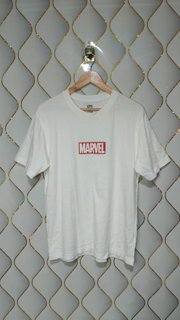 Uniqlo UT Marvel Captain America (Category: Tshirts & Polo Shirts ) located in Manila. Submitted by zariyah.1986 (Listing ID 1464756793, Image 1). Description: - Brand/Collection: Uniqlo UT x Marvel - Design: White tee with front red box logo and large Captain America shield back graphic (made of Marvel text logos) - Size: Medium - Condition: Excellent, clean fabric with no stains or damage - Style: Casual everyday wear, perfect for fans.