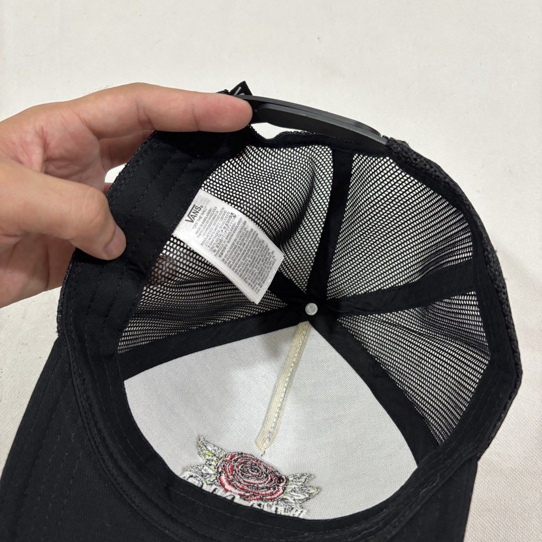 Vans Black Rose Trucker Hat (Category: Caps & Hats) located in Cavite. Submitted by itsayaaa (Listing ID 1464698997, Image 2). Description: - Brand: Vans - Color: Black with red and white embroidery - Design: Embroidered rose graphic with white outlined Vans logo on front - Features: Breathable mesh back panels and curved brim - Closure: Adjustable snapback for a custom fit - Condition: Brand new / Excellent.