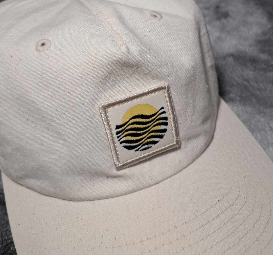 Vans Off The Wall Beige Cap with Wave Sun Patch (Category: Caps & Hats) located in Sorsogon. Submitted by johnmichae69459 (Listing ID 1464647348, Image 2). Description: - Beige Vans cap - Features embroidered wave and sun patch - Classic snapback for adjustable fit - Made in Bangladesh - 100% cotton - Perfect for everyday wear.