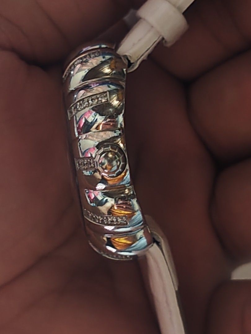 Versay (Category: Luxury Watches) located in Bacolod City. Submitted by john0000007 (Listing ID 1464609522, Image 3). Description: - Brand: VERSAY ​ - Case: Scalloped/floral bezel set with clear crystal stones, polished silver-tone metal ​ - Dial: Mother-of-pearl center with guilloché pattern, stylized numerals, crystal-set hour markers ​ - Strap: White patent/croc-embossed leather ​ - Movement: Quartz (battery-powered, standard for this style) ​